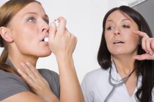 Doctor treating patient's asthma symptoms