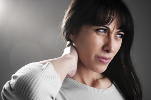 Woman suffering from fibromyalgia pain in the neck