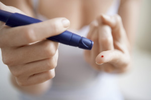 Type 1 diabetic checks her blood glucose