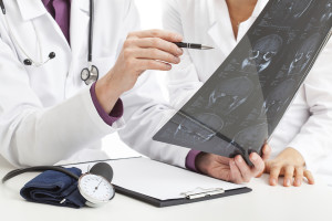 Woman examining scans in a thyroid cancer clinical trial