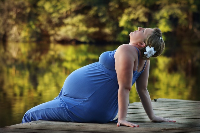 Gestational diabetic woman sitting on a dock