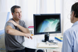 Rheumatologist meets with male patient