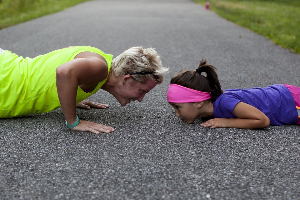 Arthritic woman exercises with her daughter