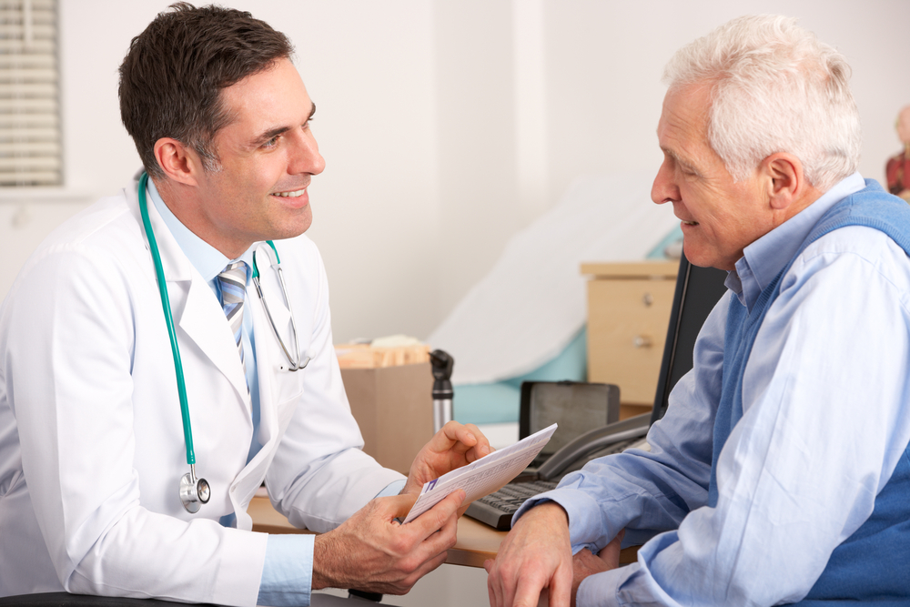 Prostate cancer patient discusses treatment options with his doctor